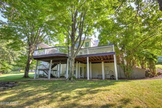 1000 Oakmont Dr, Joplin, MO 64804 - rear view of property with stairway, a deck, and a lawn