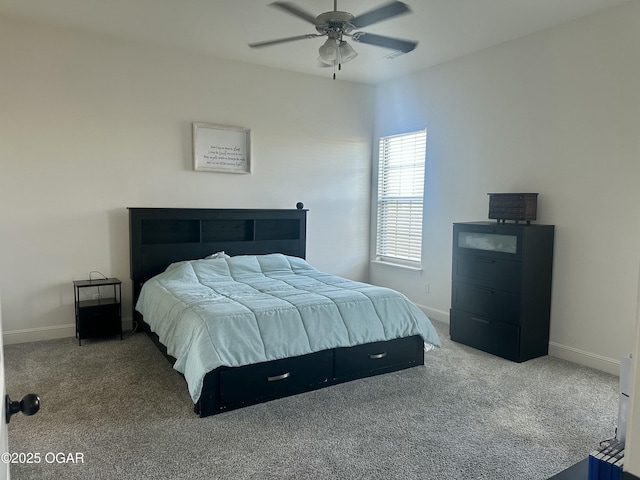 carpeted bedroom featuring baseboards and a ceiling fan
