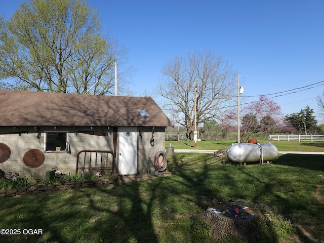 view of yard with an outdoor structure and fence