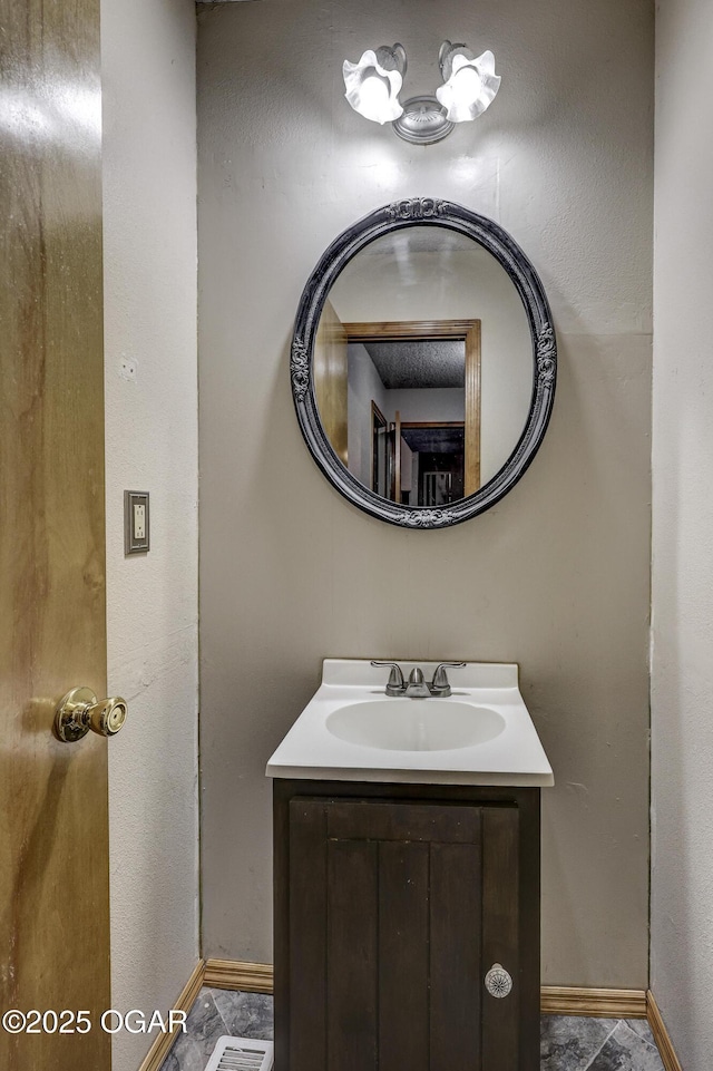 2706 E 26th St, Joplin, MO 64804 - bathroom featuring vanity and baseboards