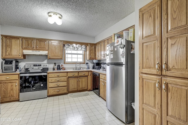2706 E 26th St, Joplin, MO 64804 - kitchen featuring under cabinet range hood, light countertops, a sink, and appliances with stainless steel finishes