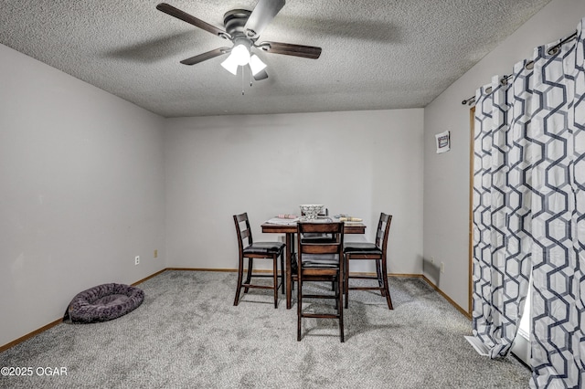 2706 E 26th St, Joplin, MO 64804 - dining area featuring a textured ceiling, ceiling fan, baseboards, and carpet floors