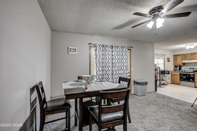 2706 E 26th St, Joplin, MO 64804 - dining space featuring light colored carpet, a textured ceiling, and a ceiling fan