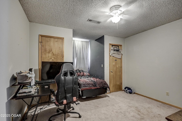 2706 E 26th St, Joplin, MO 64804 - office area with visible vents, baseboards, ceiling fan, a textured ceiling, and carpet floors