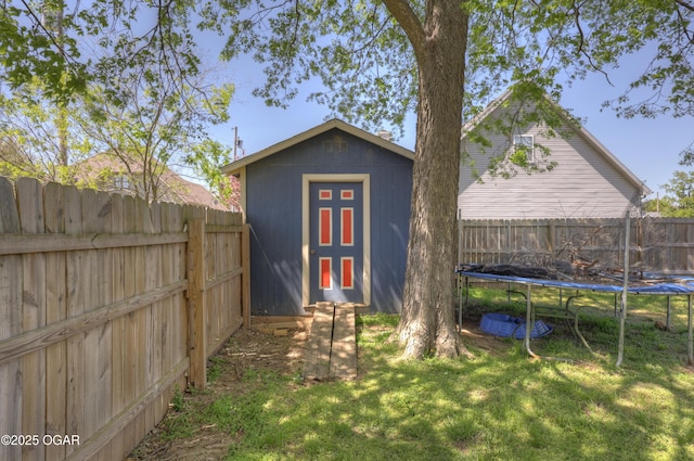 2706 E 26th St, Joplin, MO 64804 - view of shed featuring a trampoline and a fenced backyard
