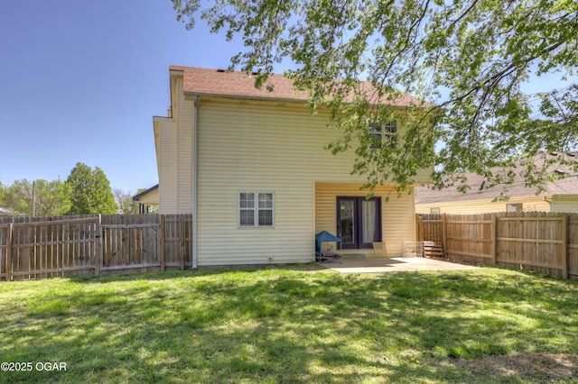 2706 E 26th St, Joplin, MO 64804 - back of house featuring a yard, a fenced backyard, and a patio area