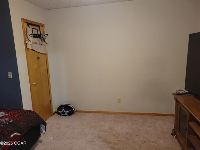 2706 E 26th St, Joplin, MO 64804 - interior space featuring a textured ceiling, carpet flooring, and baseboards