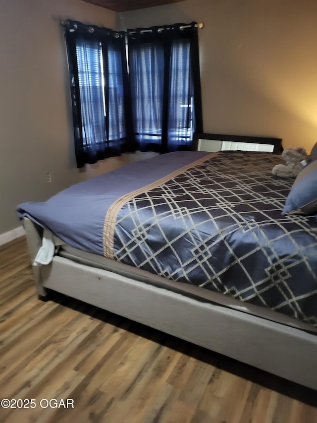bedroom featuring wood finished floors