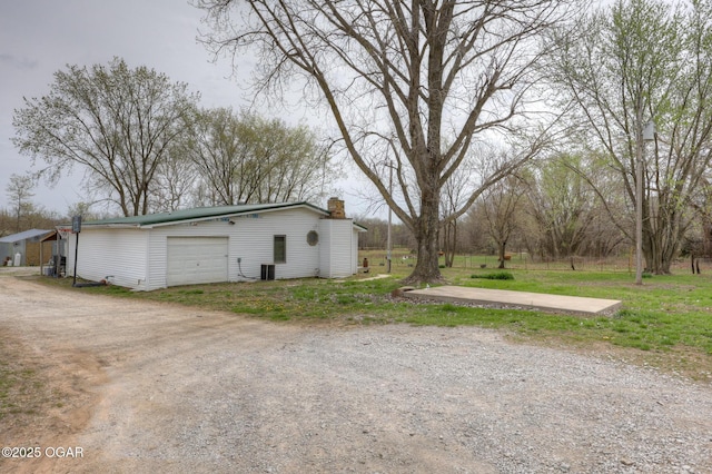 241 SE 40th Rd, Lamar, MO 64759 - exterior space with central air condition unit and an outbuilding