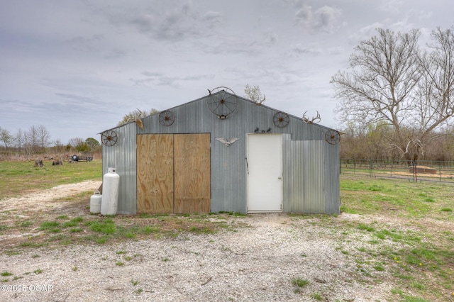 241 SE 40th Rd, Lamar, MO 64759 - view of outdoor structure featuring fence and an outbuilding