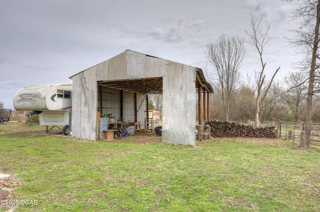 241 SE 40th Rd, Lamar, MO 64759 - view of pole building with fence and a lawn
