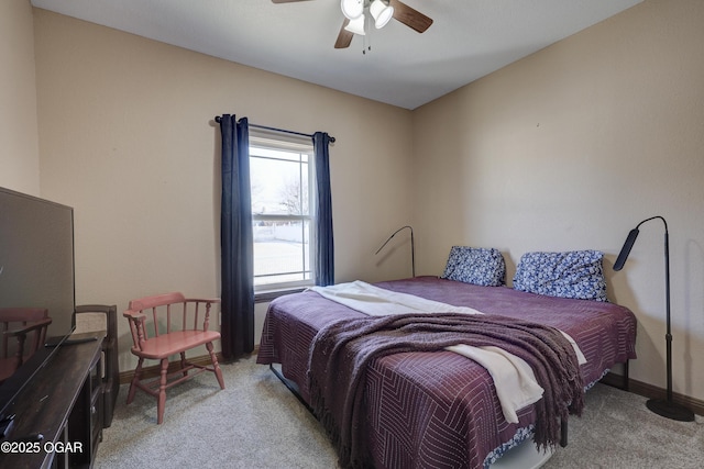 bedroom featuring baseboards, a ceiling fan, and light carpet