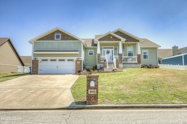 craftsman inspired home featuring a porch, a garage, fence, concrete driveway, and a front lawn
