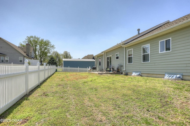 view of yard with a fenced backyard