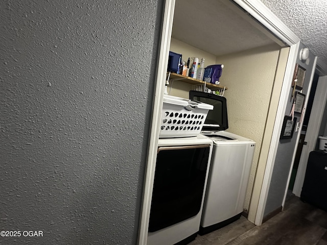2027 P St SW, Miami, OK 74354 - clothes washing area with a textured wall, washer and dryer, laundry area, and wood finished floors