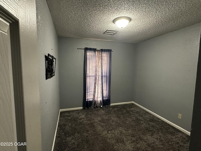 2027 P St SW, Miami, OK 74354 - spare room with a textured ceiling, visible vents, and carpet floors