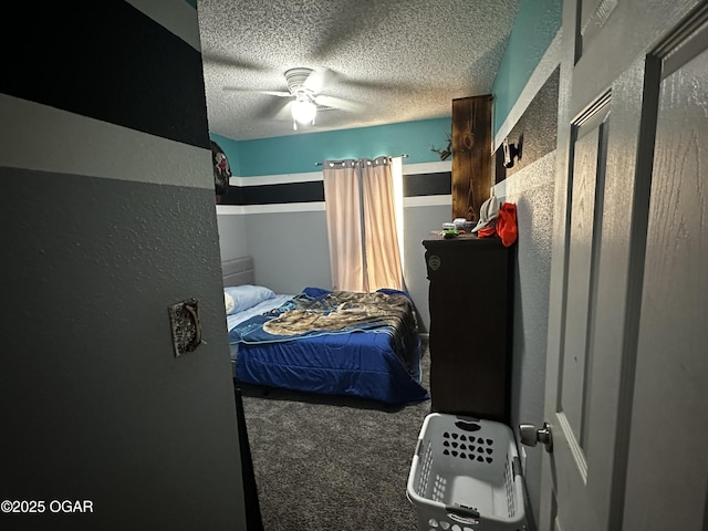 2027 P St SW, Miami, OK 74354 - carpeted bedroom with a textured ceiling, ceiling fan, and a textured wall