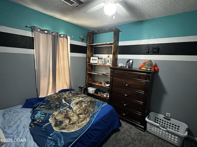 2027 P St SW, Miami, OK 74354 - bedroom with visible vents, a ceiling fan, carpet, a textured wall, and a textured ceiling
