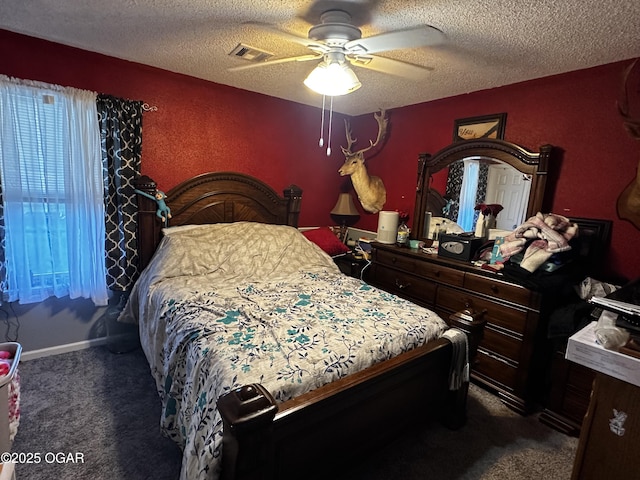 2027 P St SW, Miami, OK 74354 - bedroom with visible vents, a ceiling fan, carpet, and a textured ceiling