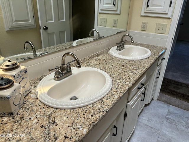 full bath with double vanity, a sink, and backsplash