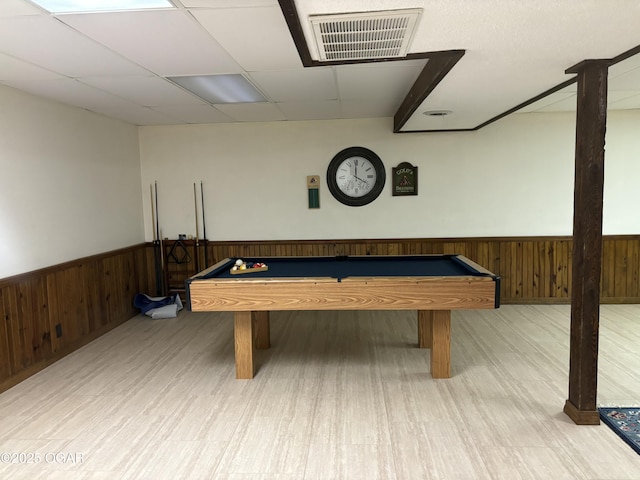 game room featuring wood walls, pool table, visible vents, and wainscoting