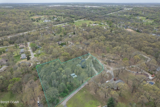 bird's eye view featuring a forest view
