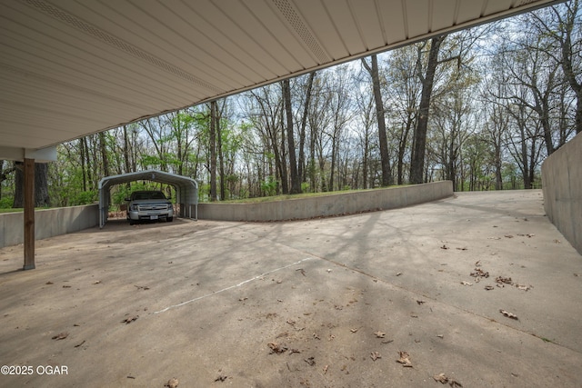 view of patio with a carport and concrete driveway
