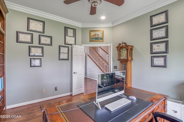 home office featuring ornamental molding, ceiling fan, wood finished floors, and baseboards