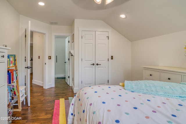 bedroom featuring dark wood finished floors, recessed lighting, a closet, baseboards, and lofted ceiling