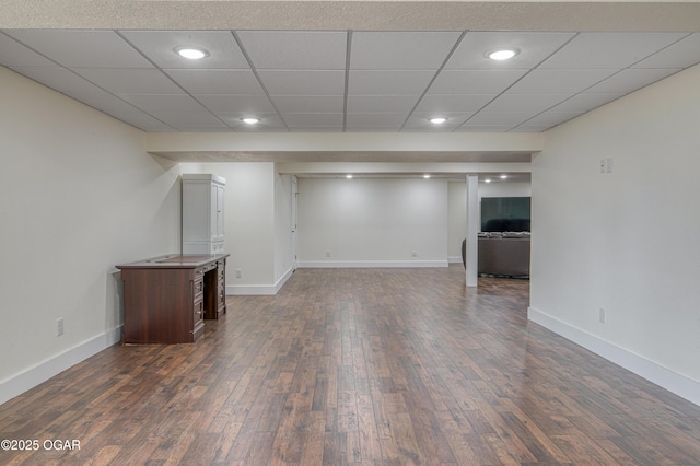 finished basement featuring recessed lighting, baseboards, and dark wood finished floors