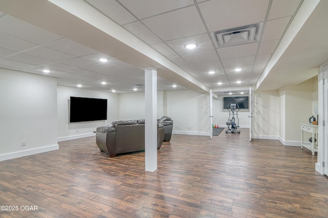 interior space featuring visible vents, baseboards, recessed lighting, dark wood-type flooring, and a paneled ceiling