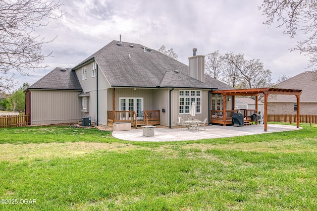 rear view of property featuring a patio, french doors, a chimney, and a pergola