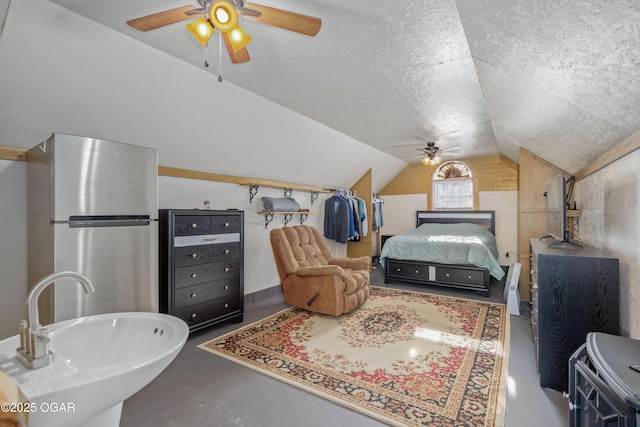 17881 Goldfinch Rd, Neosho, MO 64850 - bedroom with vaulted ceiling, a ceiling fan, a sink, a textured ceiling, and freestanding refrigerator
