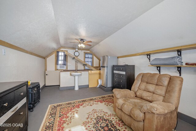 17881 Goldfinch Rd, Neosho, MO 64850 - sitting room with baseboards, vaulted ceiling, concrete flooring, and a ceiling fan