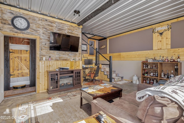 17881 Goldfinch Rd, Neosho, MO 64850 - living area with wooden walls and concrete flooring