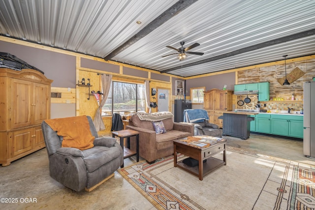 17881 Goldfinch Rd, Neosho, MO 64850 - living room featuring ceiling fan, concrete flooring, and wood walls
