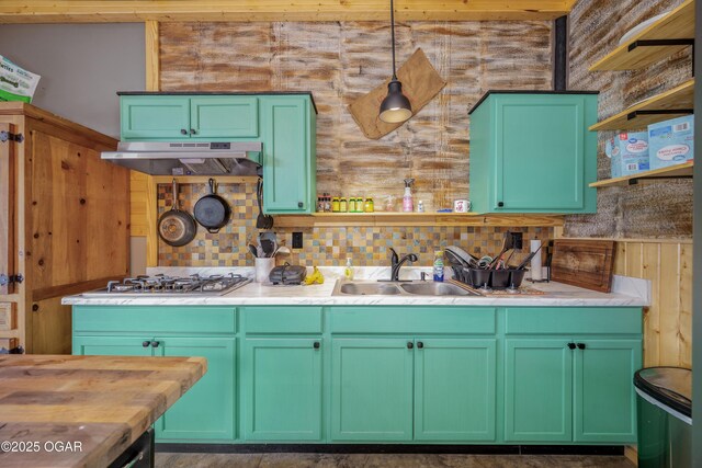 17881 Goldfinch Rd, Neosho, MO 64850 - kitchen featuring open shelves, a sink, stainless steel gas stovetop, decorative backsplash, and under cabinet range hood