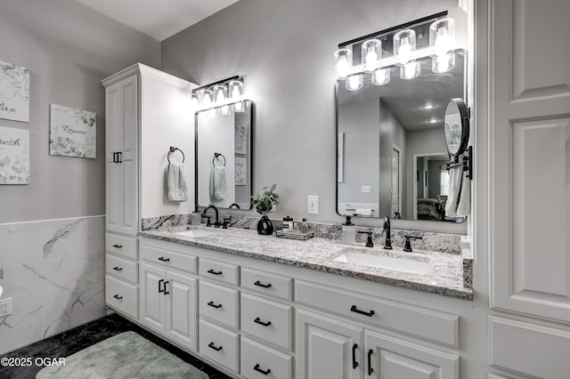 3222 Sunset Dr, Joplin, MO 64804 - ensuite bathroom featuring double vanity and marble finish floors