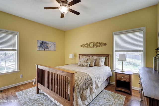 3222 Sunset Dr, Joplin, MO 64804 - bedroom featuring wood finished floors, baseboards, and ceiling fan