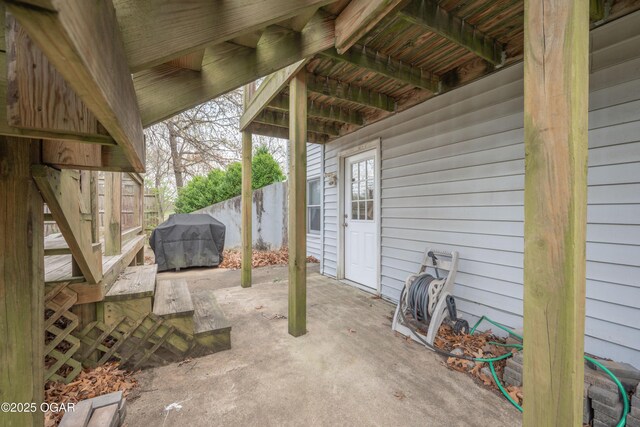 view of patio / terrace featuring grilling area and fence