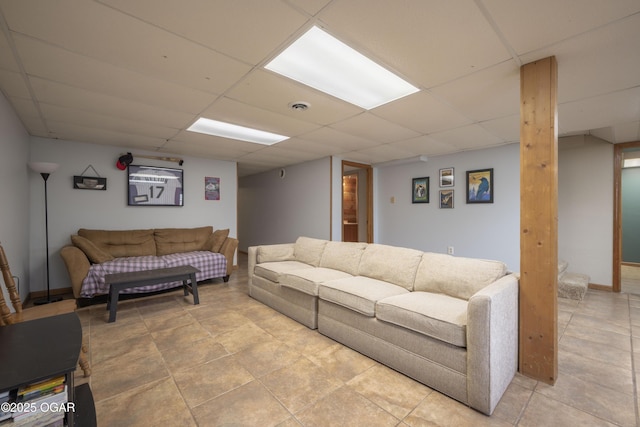 living room featuring a paneled ceiling and visible vents
