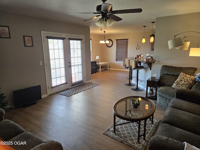 2798 Neosho Heights Ave, Neosho, MO 64850 - living room with wood finished floors, french doors, baseboards, a textured ceiling, and ceiling fan