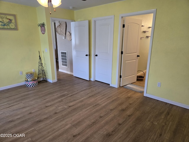 2798 Neosho Heights Ave, Neosho, MO 64850 - unfurnished bedroom featuring wood finished floors and baseboards