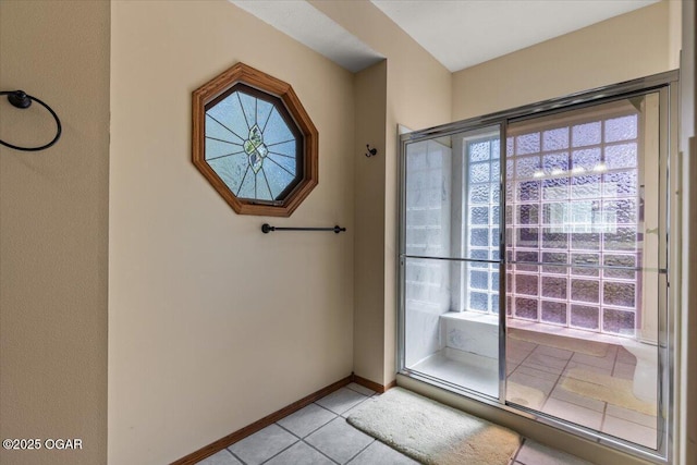 21425 Black Oak Dr, Garfield, AR 72732 - doorway with light tile patterned floors and baseboards