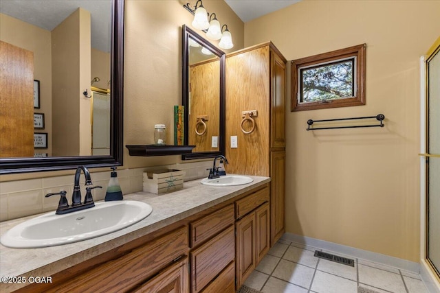 21425 Black Oak Dr, Garfield, AR 72732 - bathroom featuring double vanity, tile patterned flooring, an enclosed shower, and baseboards