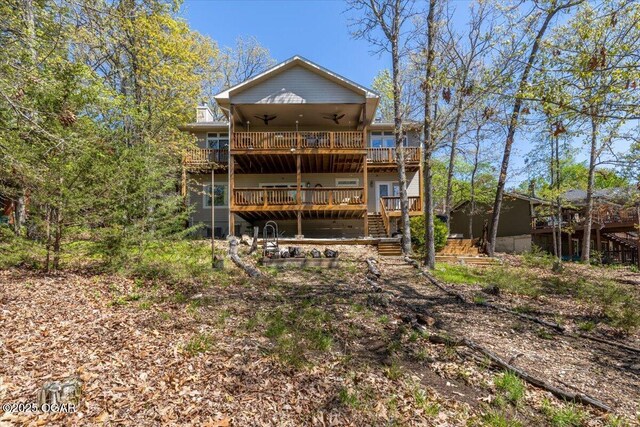 21425 Black Oak Dr, Garfield, AR 72732 - back of house featuring a ceiling fan, a wooden deck, and stairway