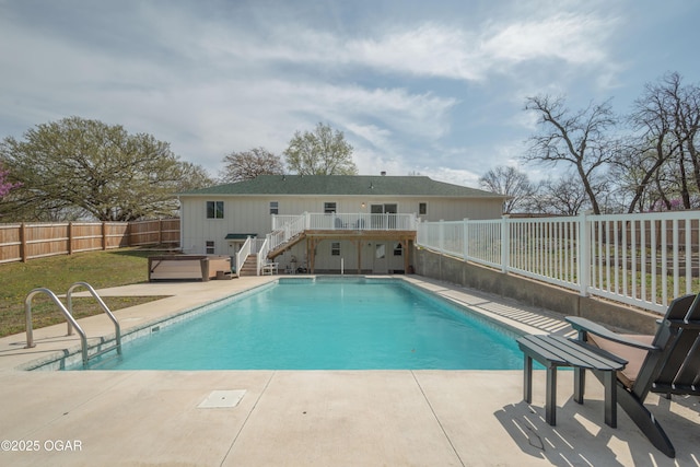 view of swimming pool with a patio, a deck, a fenced backyard, a fenced in pool, and stairs