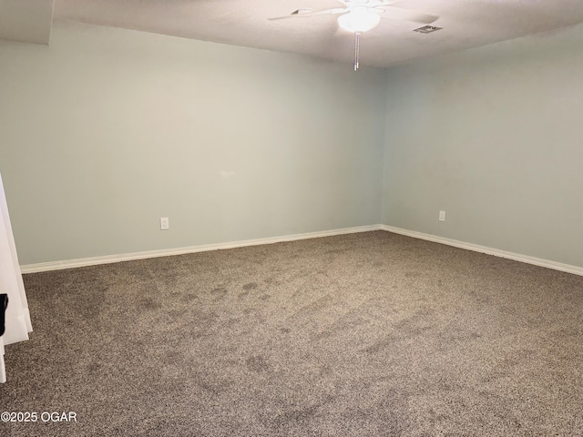 unfurnished room featuring a ceiling fan, baseboards, visible vents, and carpet floors