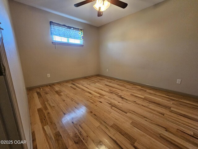 4919 State Highway 76, Anderson, MO 64831 - empty room featuring baseboards, a ceiling fan, and wood finished floors