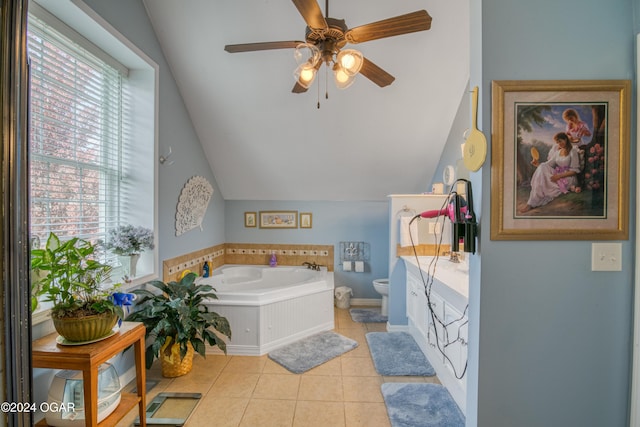 607 S Morgan Ct, Joplin, MO 64801 - full bathroom featuring vaulted ceiling, a bath, ceiling fan, toilet, and tile patterned flooring